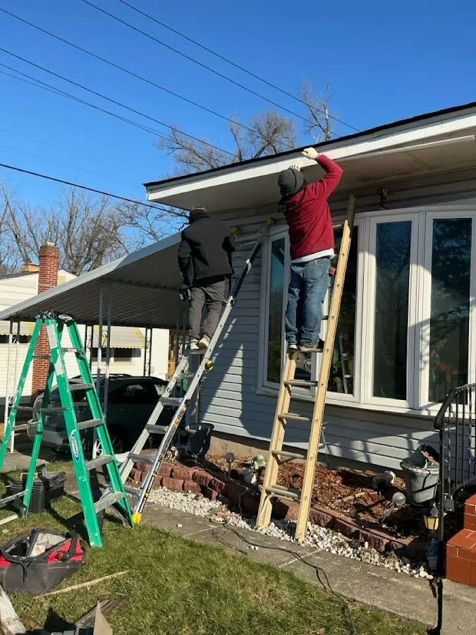 Restoration crew performing exterior repair in Girard